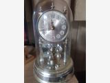 old clock with pendulum swing at the bottom
